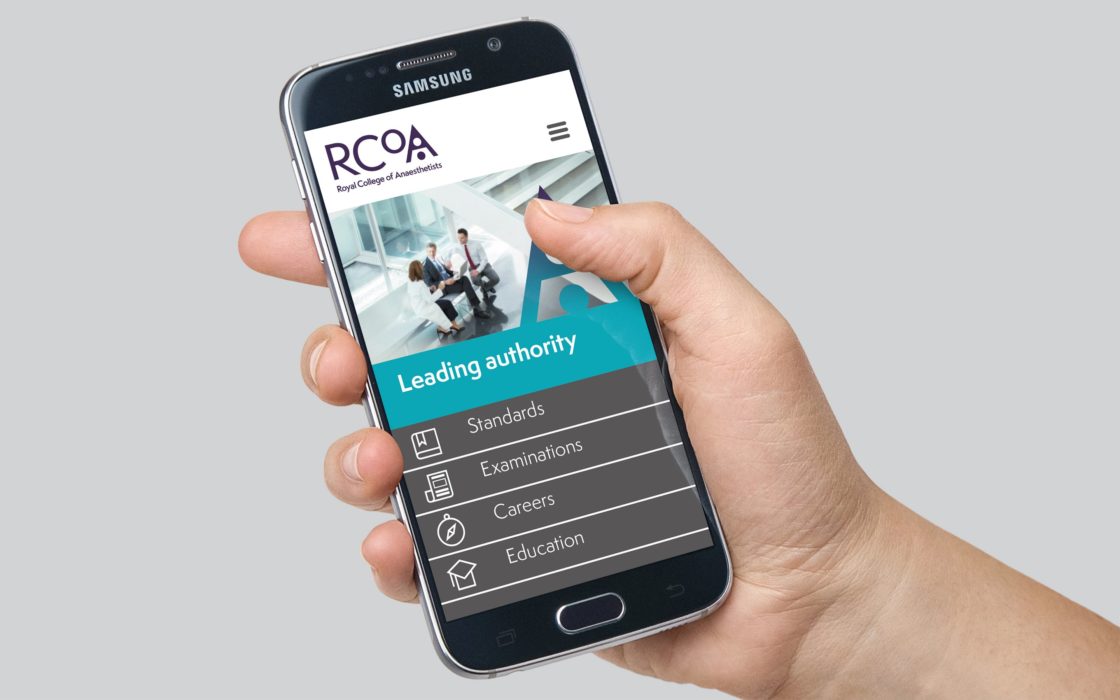Phone displaying RCoA mobile website in a persons hand.