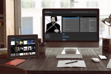 Mac and Tablet on a dark wood desk showing Lloyd Cole.com
