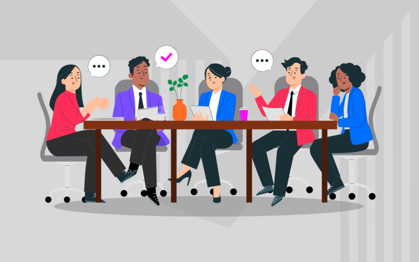 Team discussing documents around a table, representing annual report design in the boardroom.