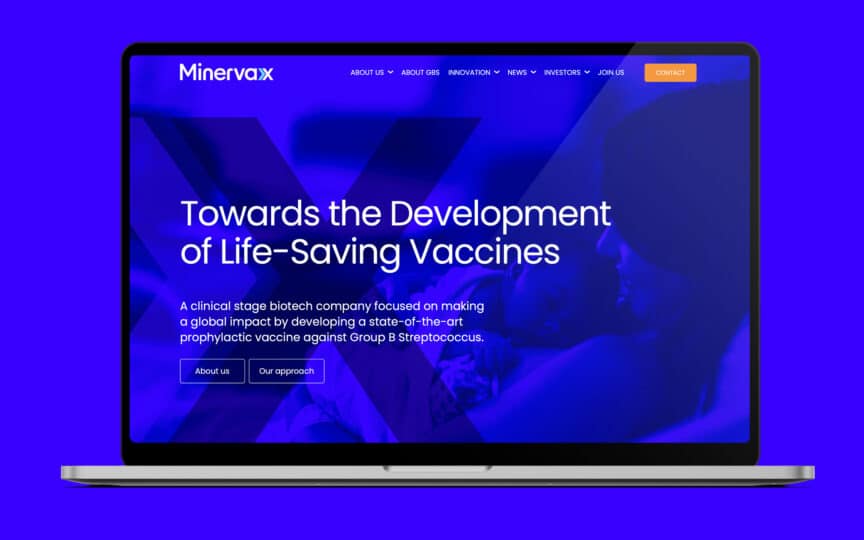 MinervaX website on MacBook screen.