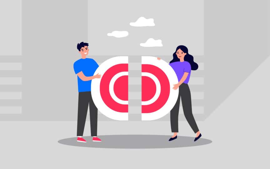 Two people joining two halves of a bullseye target