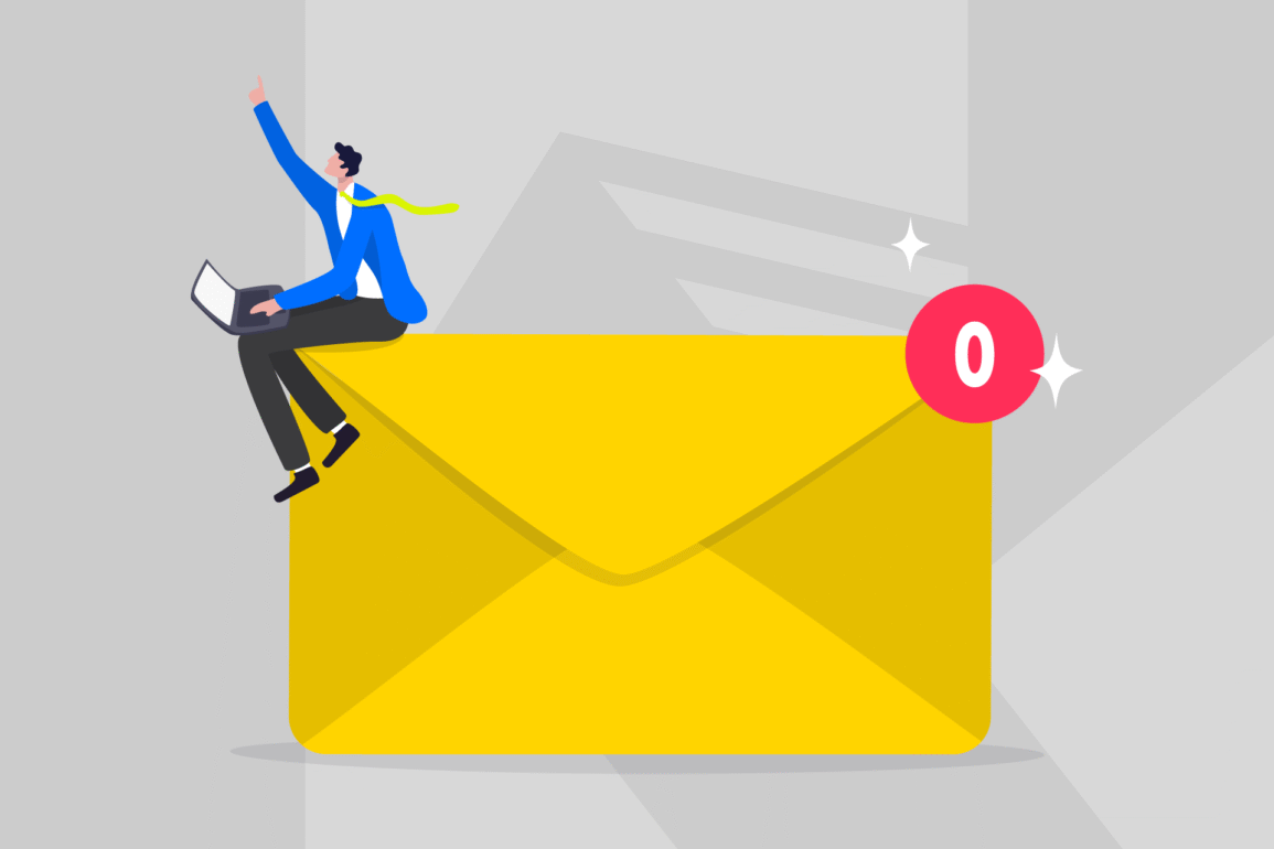 A man sits on an envelope, working on a laptop, symbolizing innovative Brand Communications.