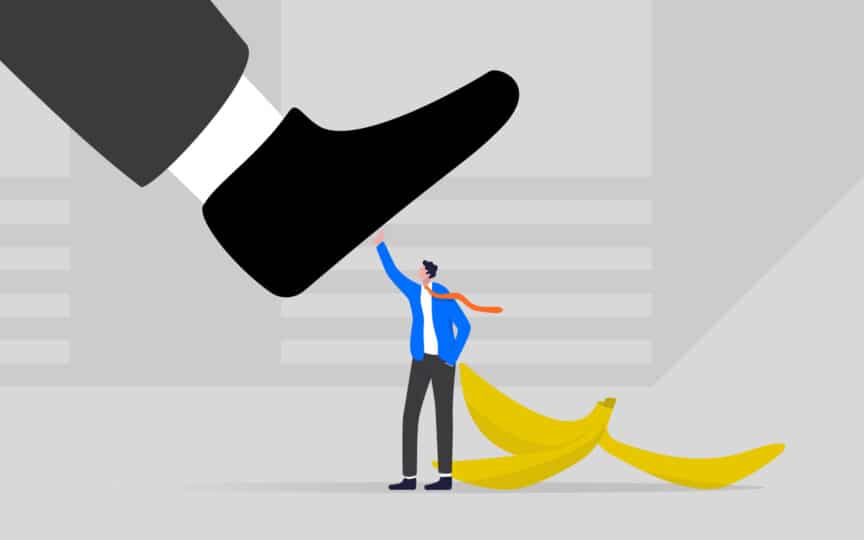 An illustration of a small person preventing a leg from stepping on a banana peel.