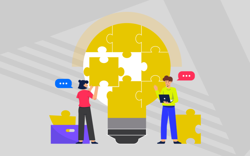 Two people finishing puzzle pieces in shape of lightbulb.